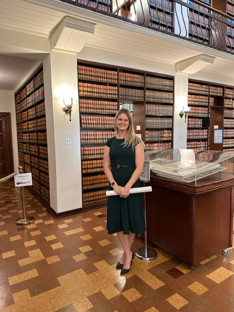 attorney standing in a library